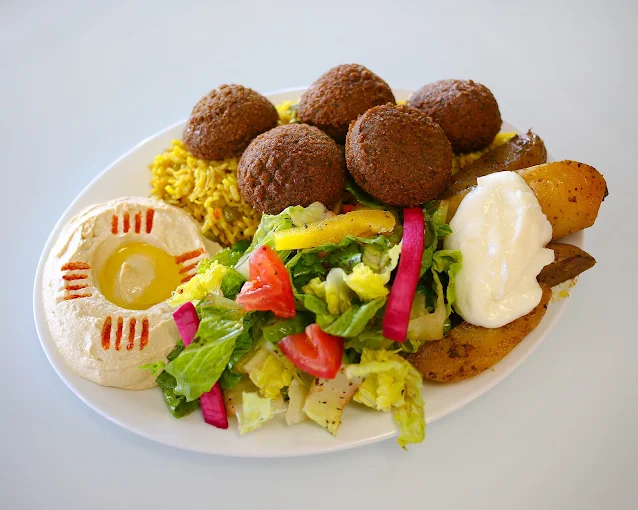 Crispy potato wedges with garlic sauce at Empire Shawarma Calgary